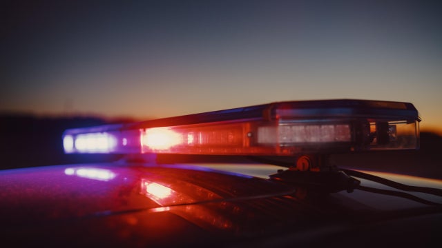Close-up Shot of Police Car Siren Lights. Offices of the Law Ready for Action, Chase the Criminals, Arrest Offenders and Fight Crime. Stylish Cinematic Lights with Sunset Sky 