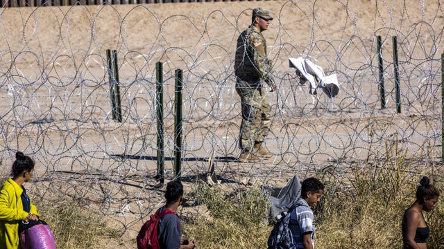 Migrants cross the Rio Grande from Mexico on Dec. 10, 2024. 