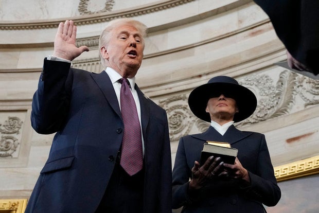 Donald Trump is sworn in as the 47th president of the United States by Chief Justice John Roberts as Melania Trump holds the Bible on Jan. 20, 2025. 
