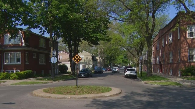 Close Up Shot Focused on Yellow Tape Showing Text Police Line Do Not Cross. Restricted Area of a Crime Scene. Bokeh Background with Flickering Siren Lights. Forensics Team Working on a Case 