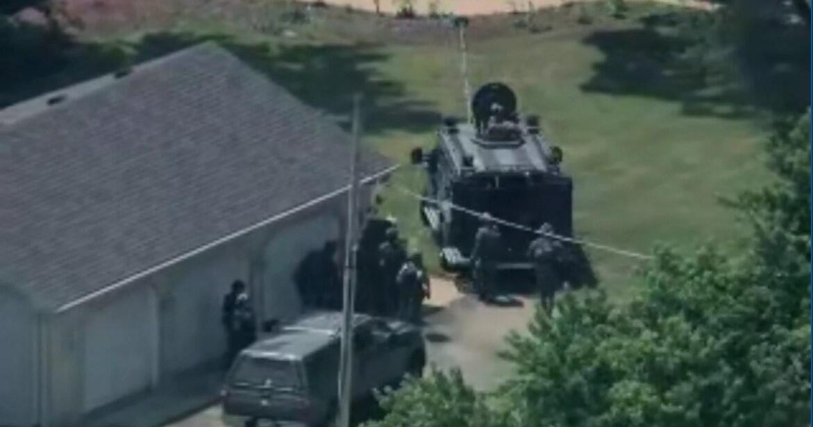 Police SWAT teams, armored vehicles surround home in McHenry, Illinois 